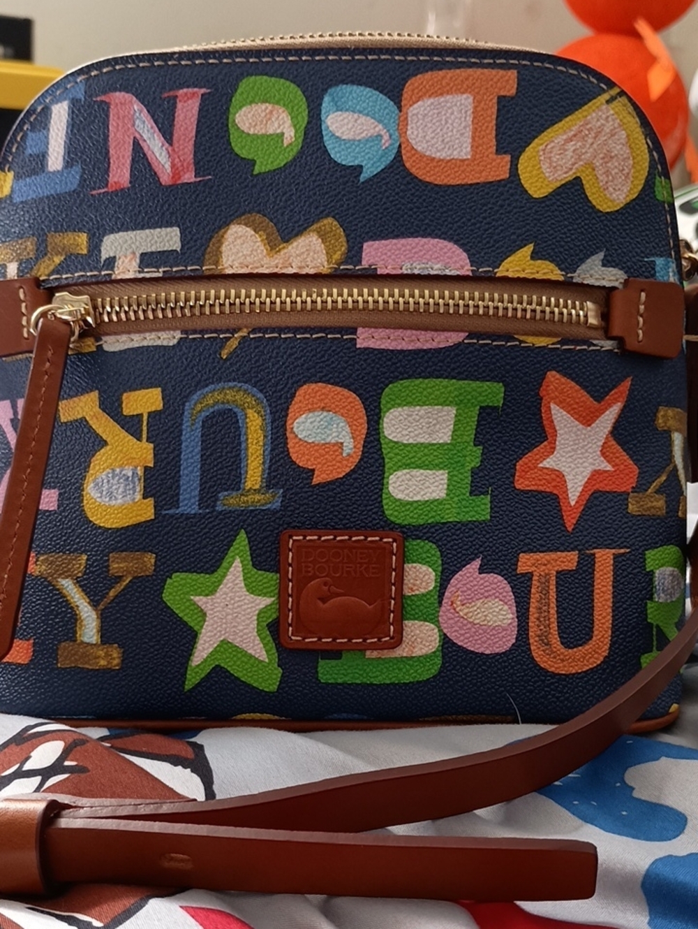 Dooney & Bourke Navy Multi Letter-Print Crossbody with Brown Trim